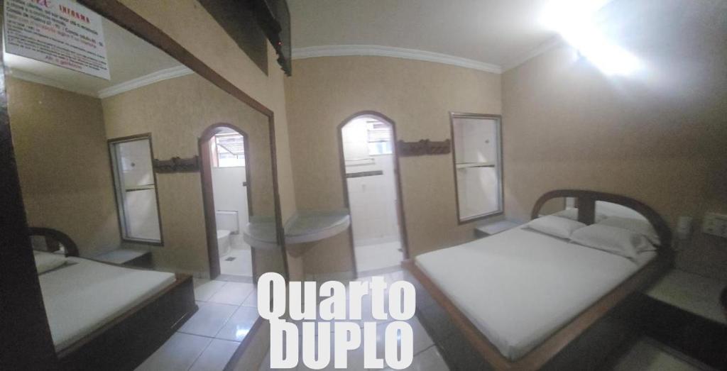 Postel nebo postele na pokoji v ubytování HOTEL ONIX - Centro, Belo Horizonte