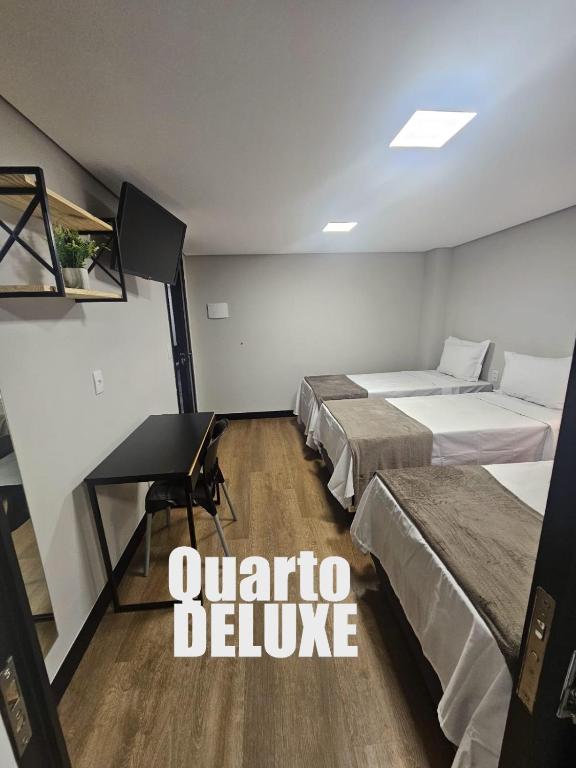 Postel nebo postele na pokoji v ubytování HOTEL ONIX - Centro, Belo Horizonte