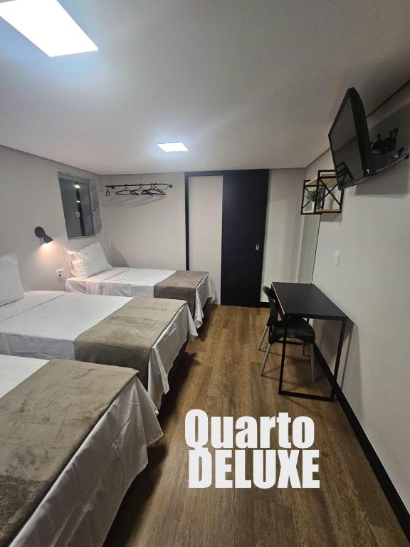 Postel nebo postele na pokoji v ubytování HOTEL ONIX - Centro, Belo Horizonte
