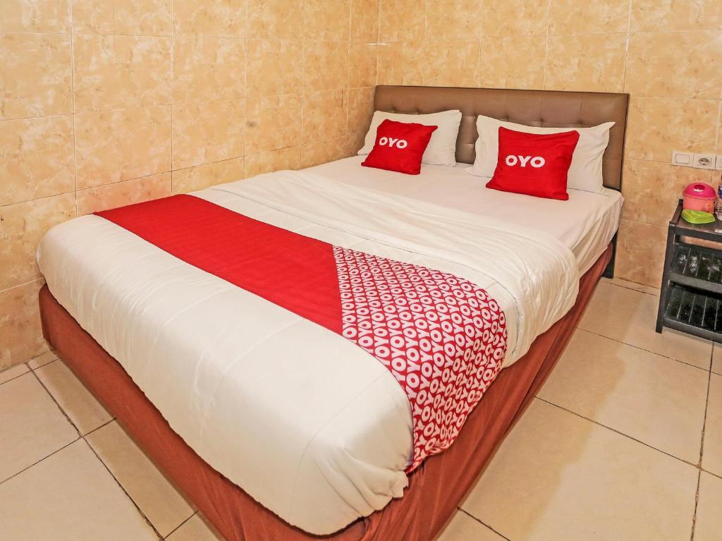 Postel nebo postele na pokoji v ubytování SUPER OYO 92672 Hotel Bsd