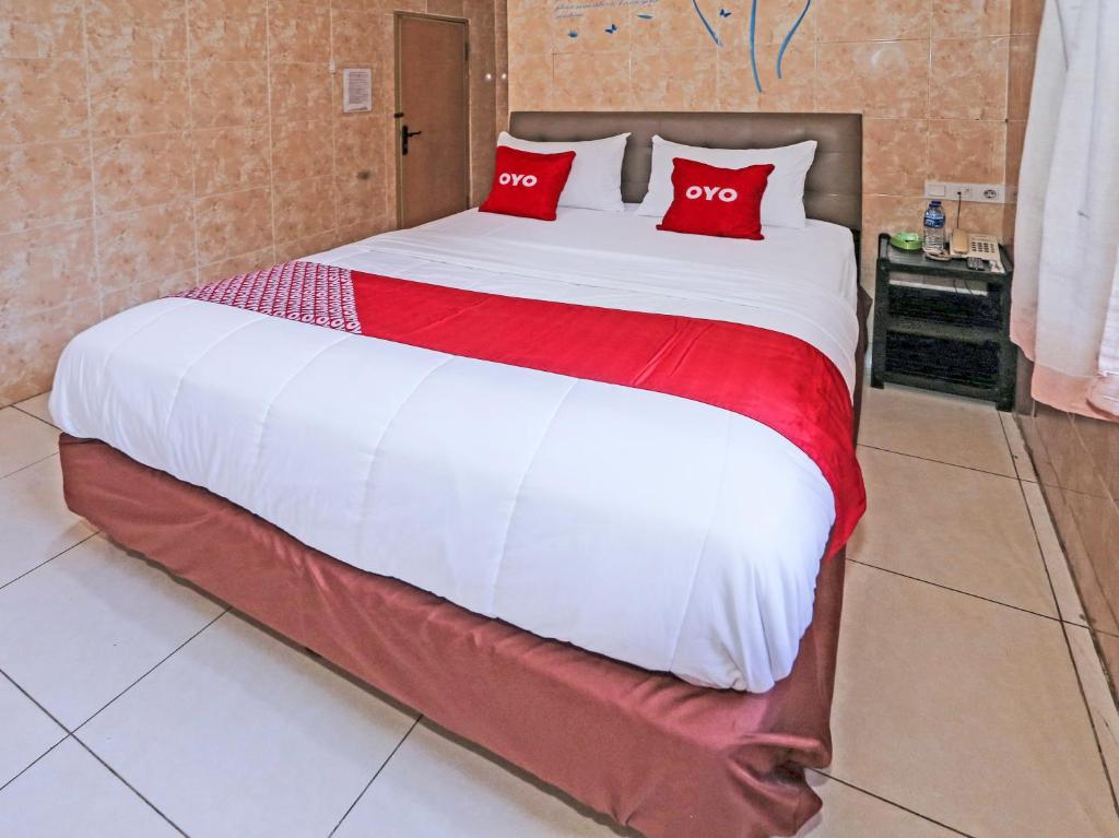 Postel nebo postele na pokoji v ubytování SUPER OYO 92672 Hotel Bsd