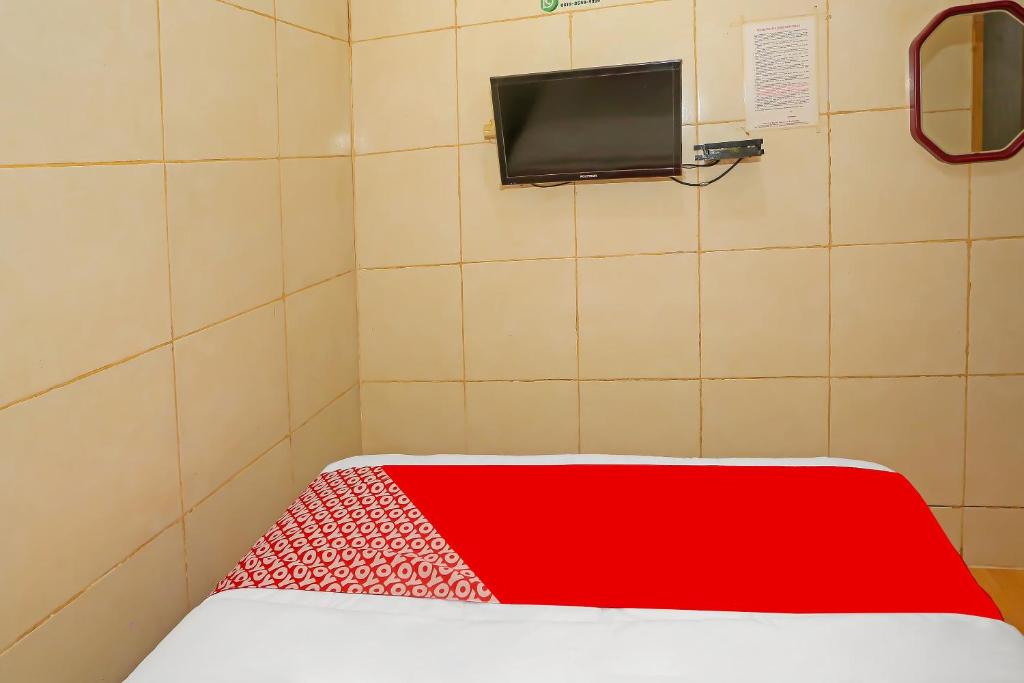 Postel nebo postele na pokoji v ubytování OYO 92678 Hotel Melati