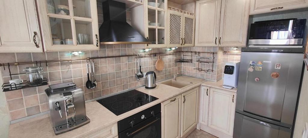 Kuchyň nebo kuchyňský kout v ubytování Luxury Sea Sunset Deluxe Apartment