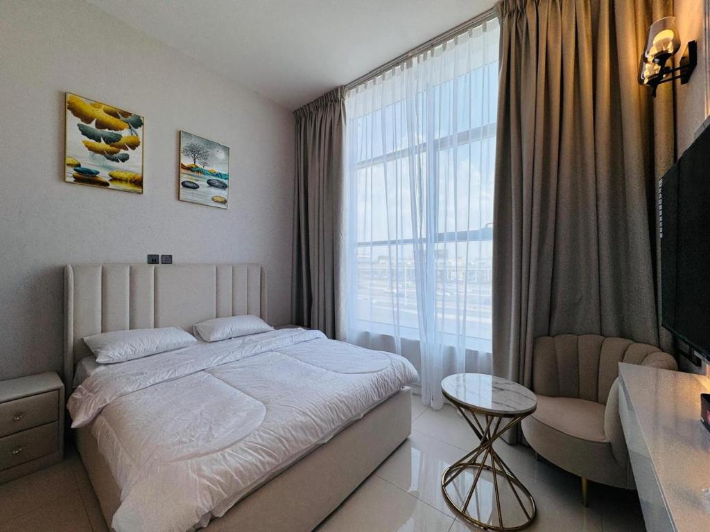 a bedroom with a bed and a large window at Al Manara Premium Deluxe Sheikh Zayed View Studio in Dubai