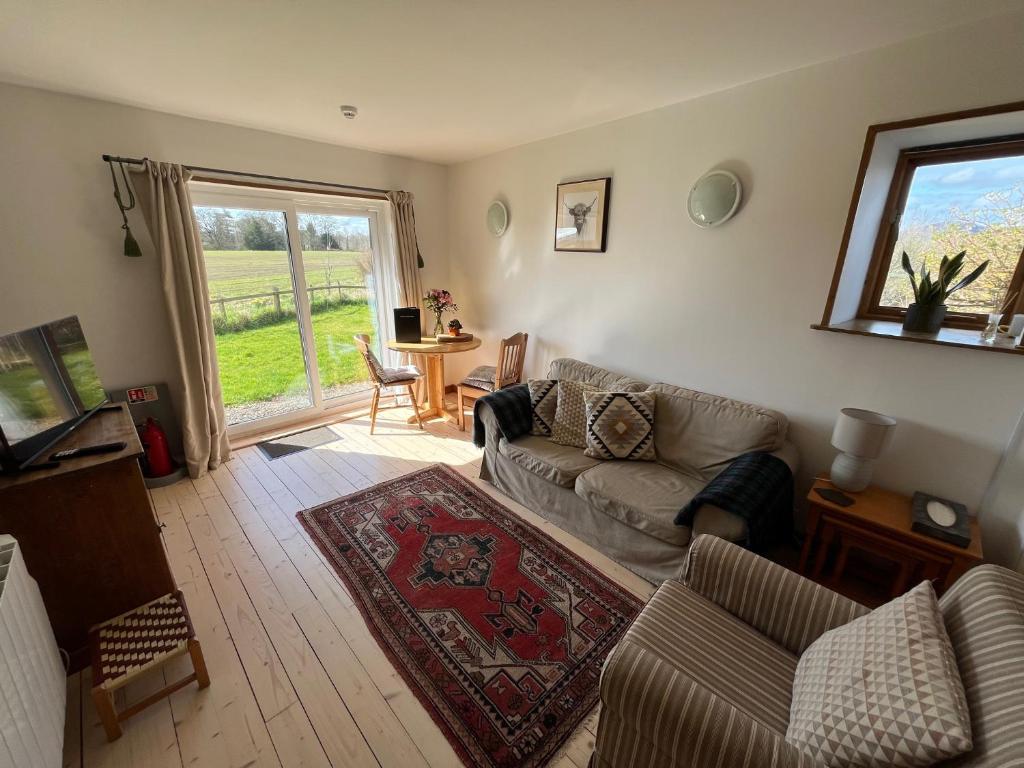 Istumisnurk majutusasutuses Stable Cottage by Roslin Glen