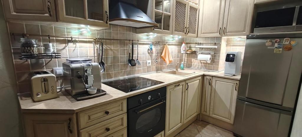 Kuchyň nebo kuchyňský kout v ubytování Luxury Sea Sunset Deluxe Apartment