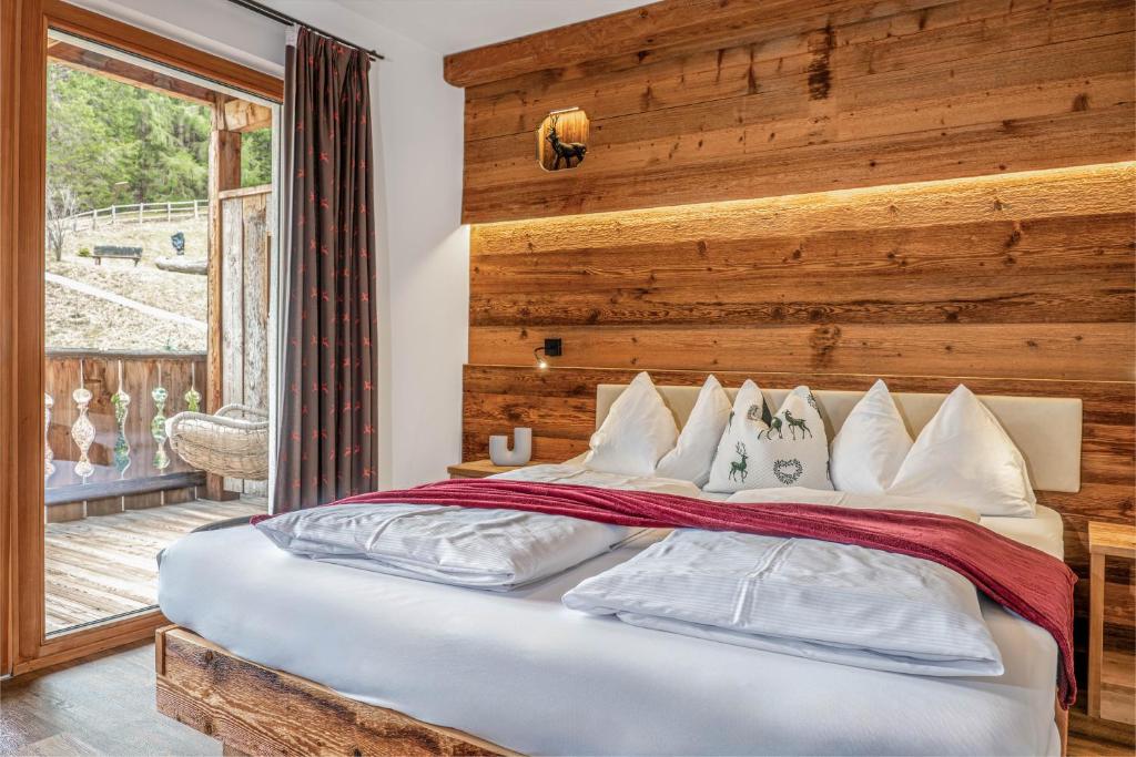 Postel nebo postele na pokoji v ubytování Alpine Mountain Chalet