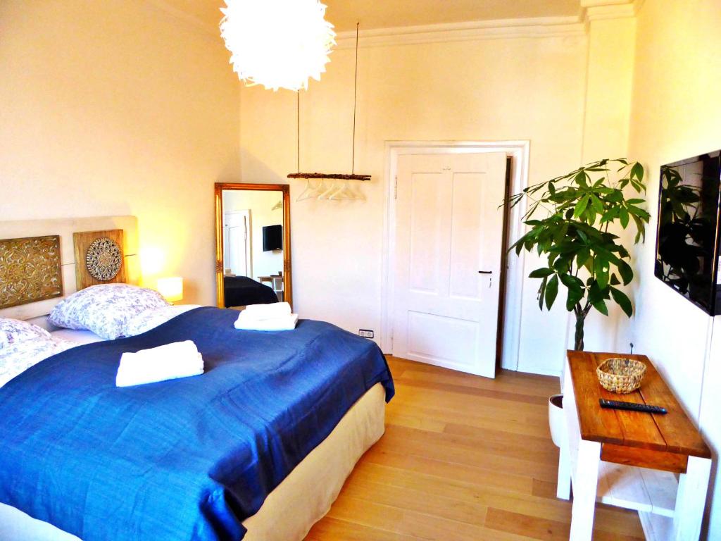 Postel nebo postele na pokoji v ubytování Art Hotel & Hostel