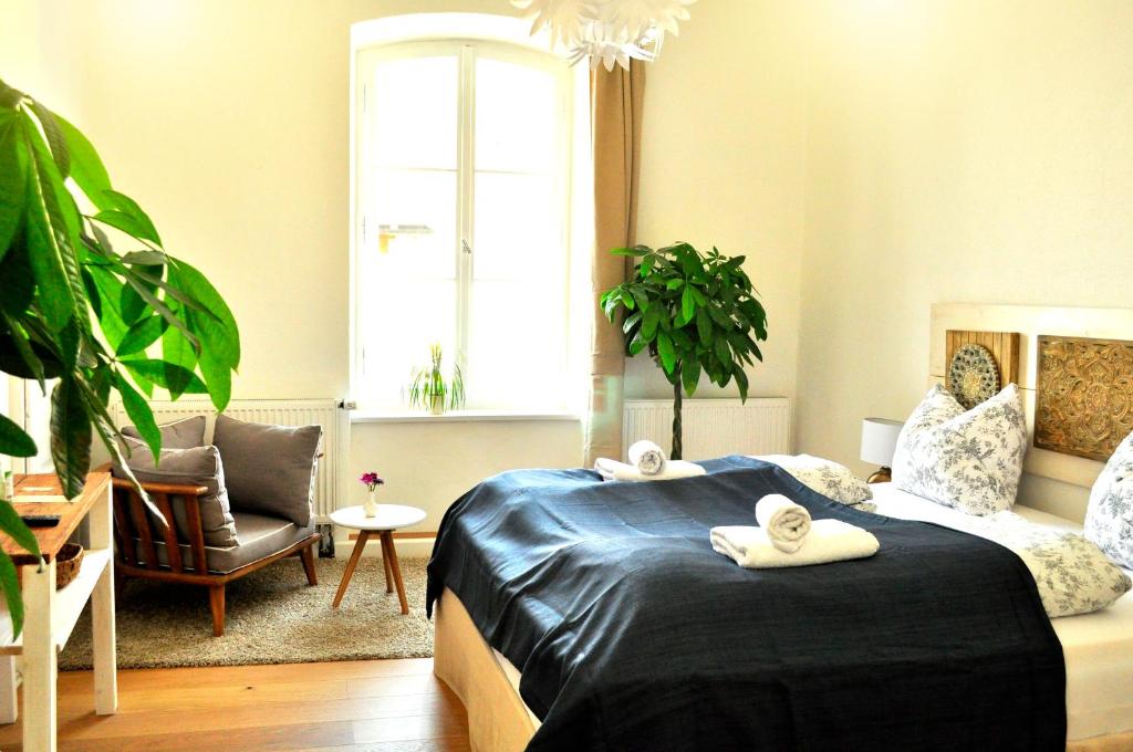 Postel nebo postele na pokoji v ubytování Art Hotel & Hostel
