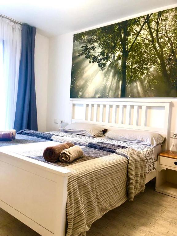 a bedroom with a bed with a large window at Comfort in Playa las Americas in Playa de las Americas