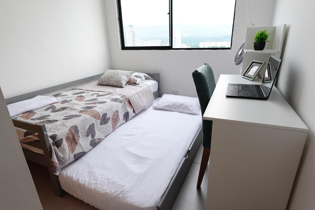 Letto o letti in una camera di Apartamento frente a clínica Foscal