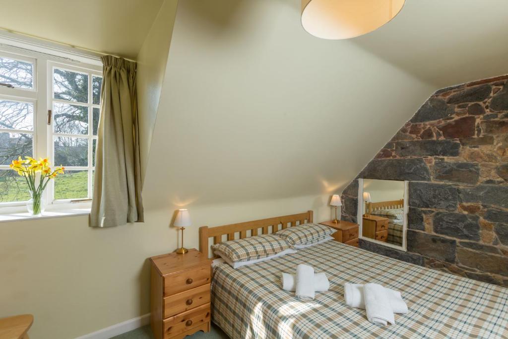 Postel nebo postele na pokoji v ubytování Le Douit Farm Self Catering