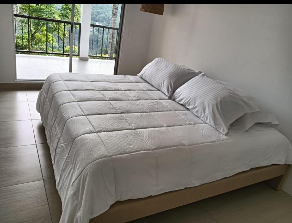 Ένα ή περισσότερα κρεβάτια σε δωμάτιο στο Najuve