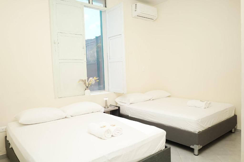 Postel nebo postele na pokoji v ubytování Casa Comala