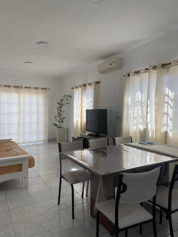 a dining room with a table and chairs at Casa ciudad de San Luis in San Luis