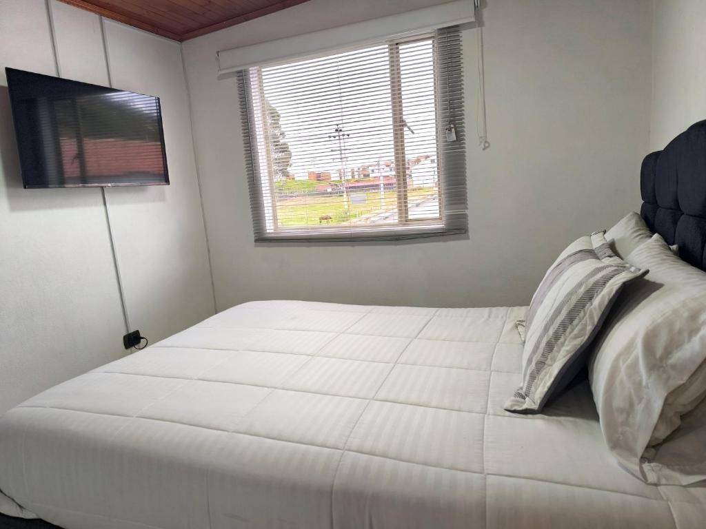 Postel nebo postele na pokoji v ubytování Hotel Cordi