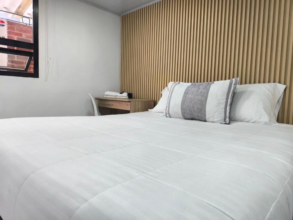 Postel nebo postele na pokoji v ubytování Hotel Cordi