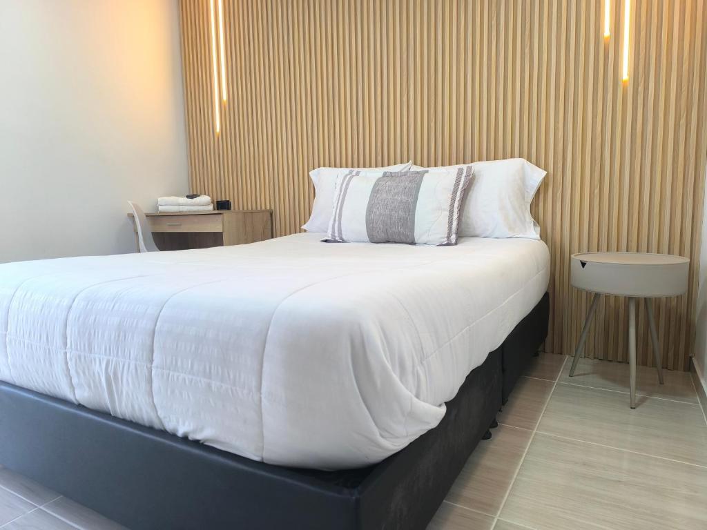 Postel nebo postele na pokoji v ubytování Hotel Cordi