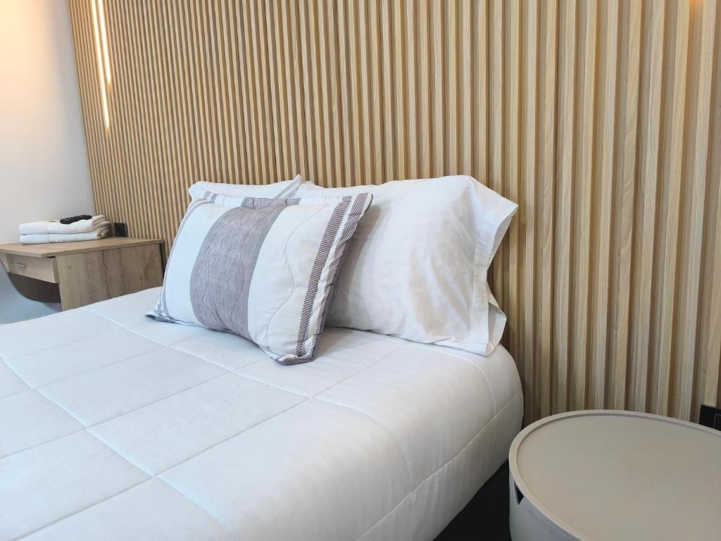 Postel nebo postele na pokoji v ubytování Hotel Cordi