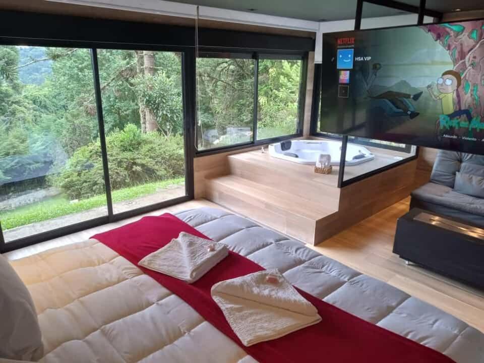 Postel nebo postele na pokoji v ubytování Hospedagem Spa da Alma