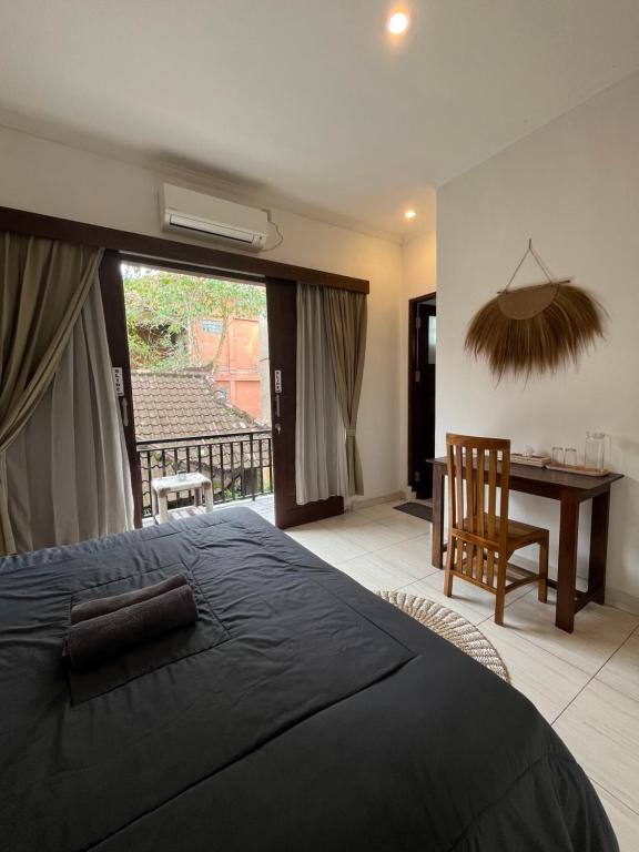 Postel nebo postele na pokoji v ubytování ODA Guest House Ubud