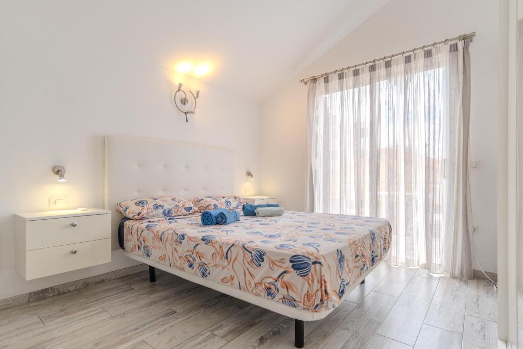a bedroom with a bed and a large window at Renovated Villa in Las Americas Sea Coast in Playa de las Americas
