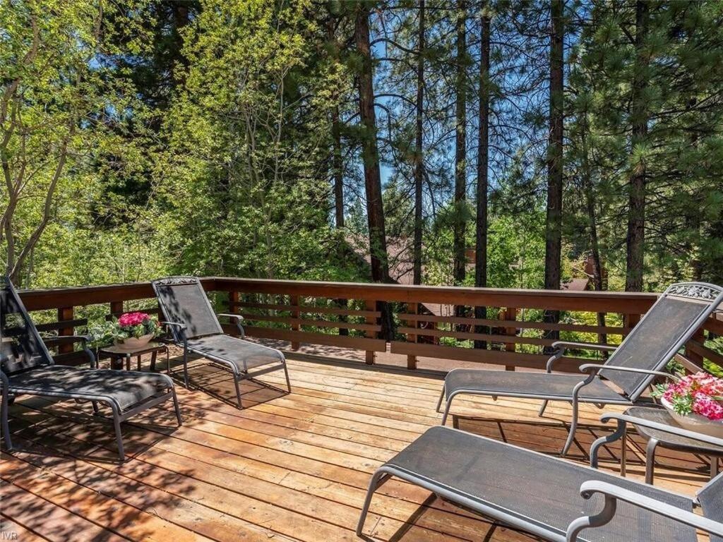 three chairs sitting on a deck with trees in the background at THC0649 - Third Creek Comfort in Incline Village