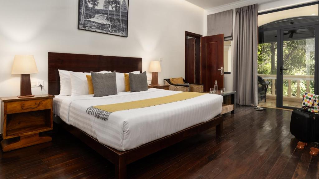 Postel nebo postele na pokoji v ubytování Pavillon d'Orient Boutique Hotel