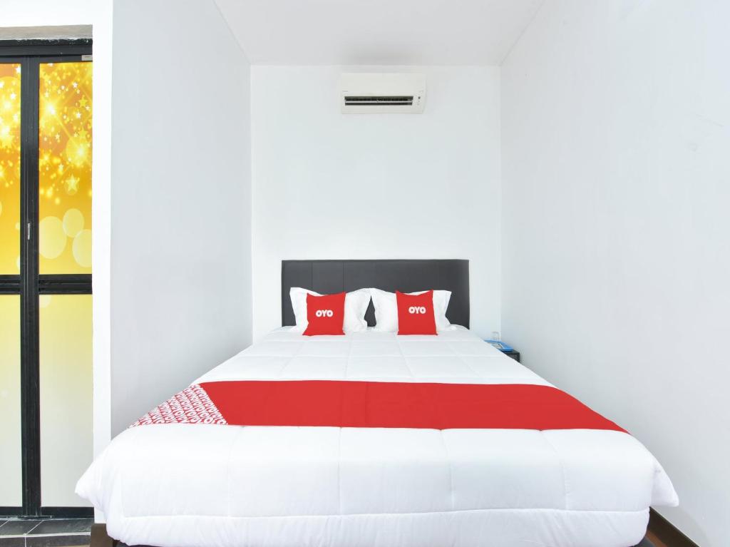 OYO 90869 Hotel Madeena Innにあるベッド
