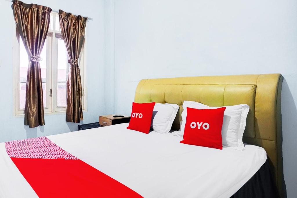Postel nebo postele na pokoji v ubytování OYO 93071 Home Stay Kembar Syariah