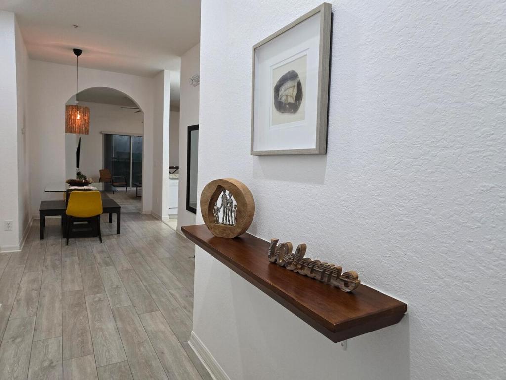 a living room with a counter and a dining room at Orlando Family Getaway Near Walt Disney World in Kissimmee