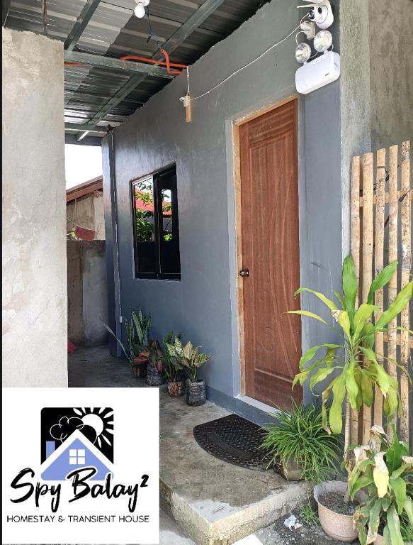 a front door of a house with plants at Spy Balay 2x Homestay in Butuan