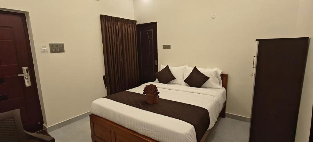 Postel nebo postele na pokoji v ubytování Rv Resorts Yercaud