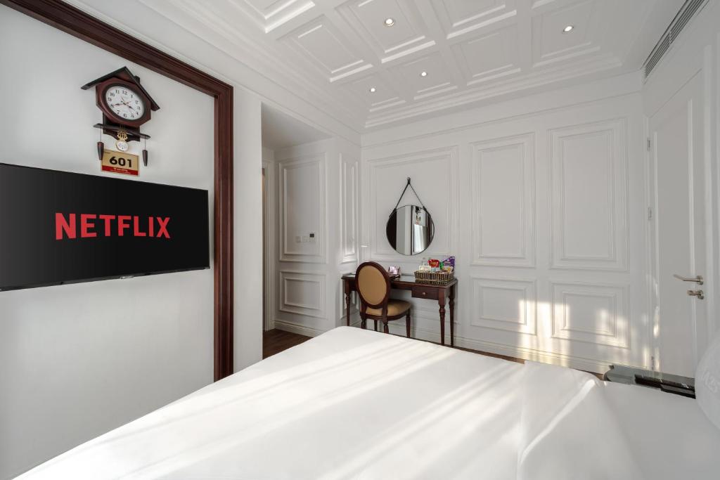 Postel nebo postele na pokoji v ubytování A25 Hotel - 18 Nguyễn Hy Quang