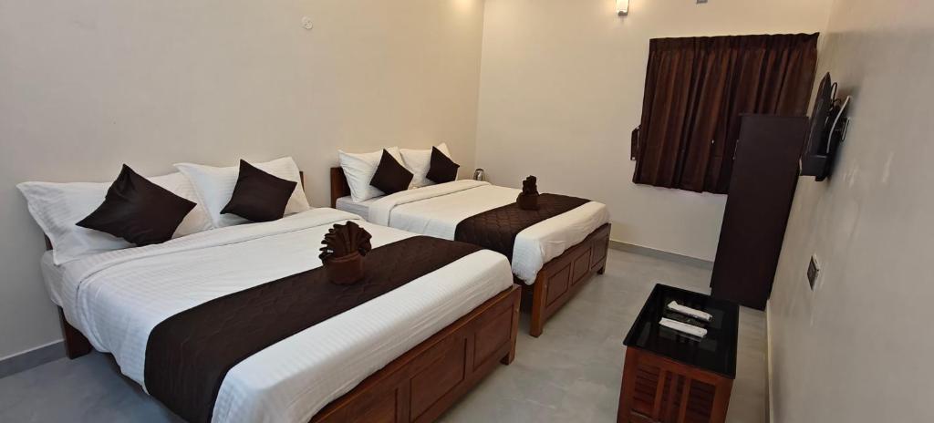 Postel nebo postele na pokoji v ubytování Rv Resorts Yercaud