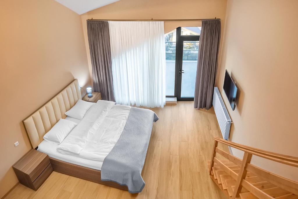 Postel nebo postele na pokoji v ubytování Terrace Akhaltsikhe