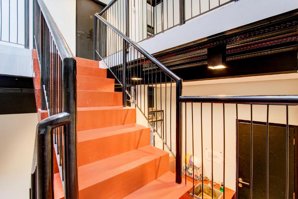 an image of a staircase in a building at Hotel O Rubina Syariah Hotel in Purbolinggo