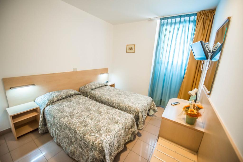 Postel nebo postele na pokoji v ubytování Hotel Johnson