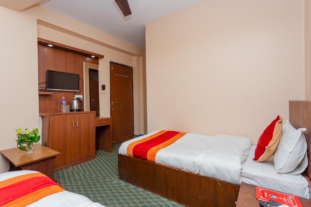 Postel nebo postele na pokoji v ubytování OYO 801 Hotel View Global