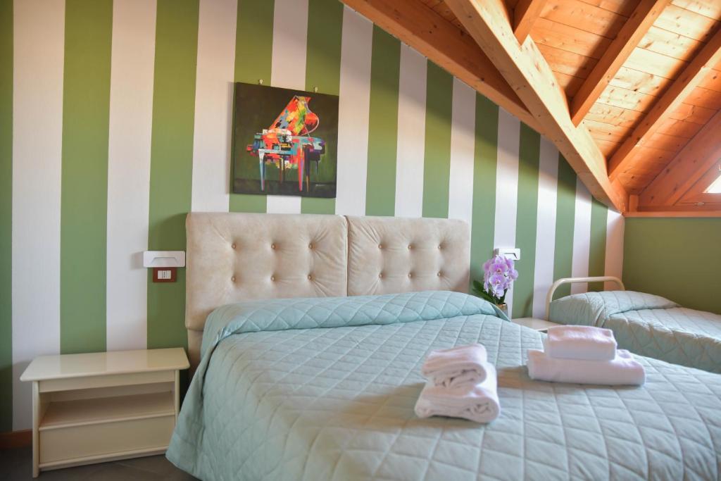 En eller flere senge i et værelse på Made in Italy