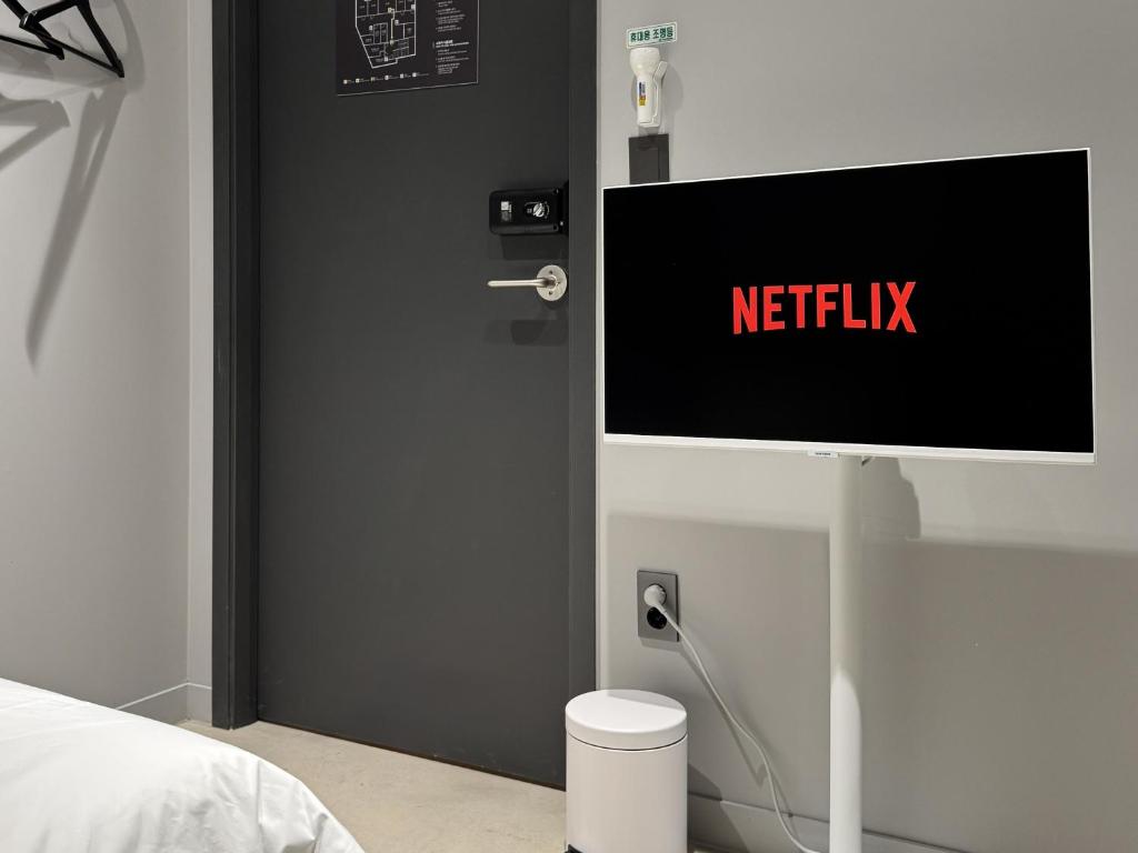 TV a/nebo společenská místnost v ubytování Original Backpackers