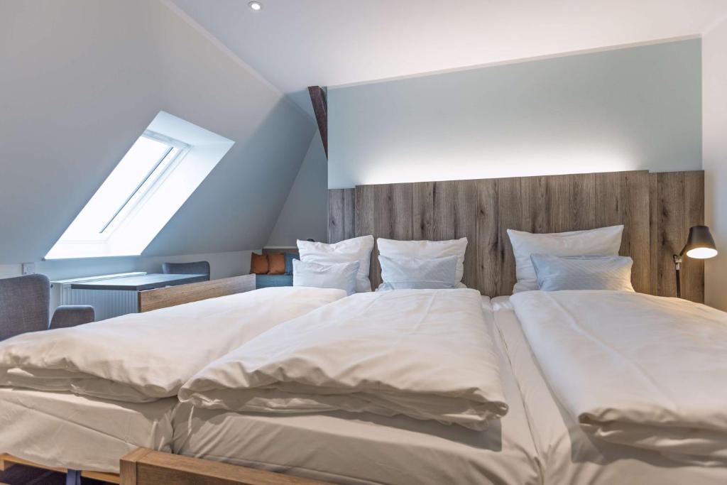 Postel nebo postele na pokoji v ubytování Best Western Plus Theodor Storm Hotel