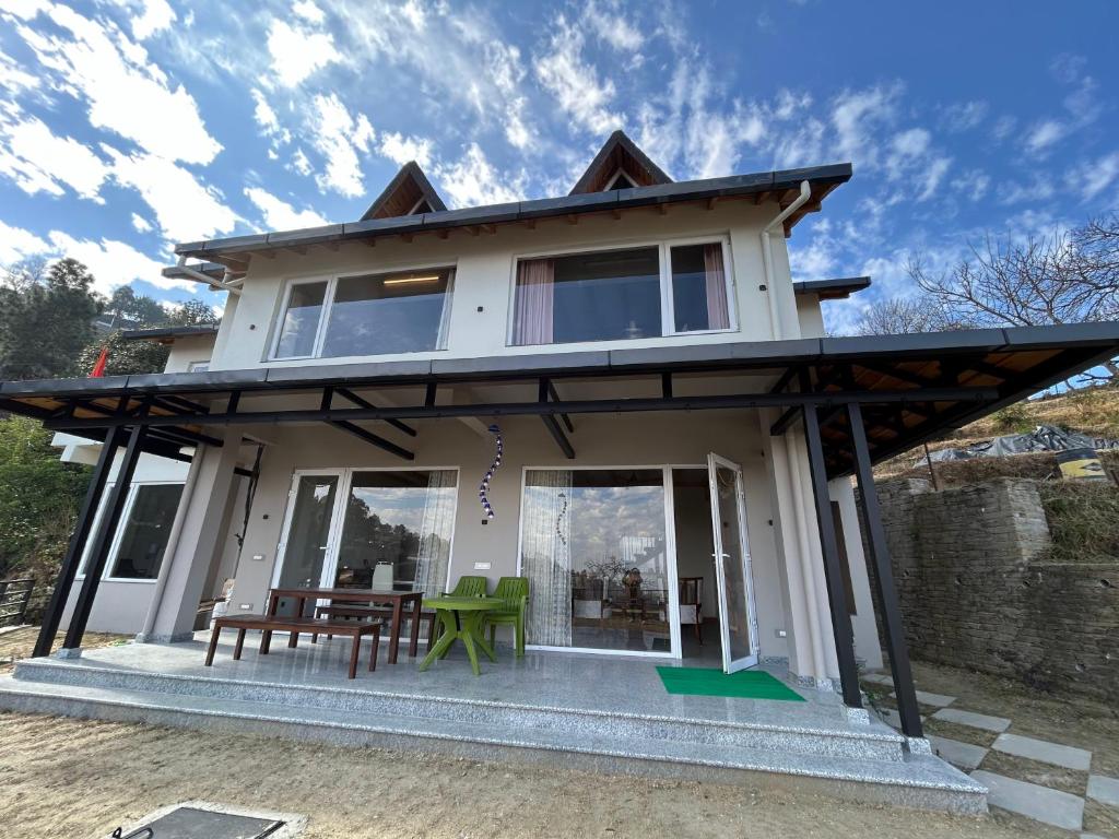 a small house with a roof at VAAS Cottage in Mukteshwar