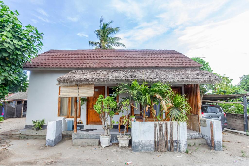 Photo de la galerie de l'établissement OYO 93729 Radesa Family Homestay, à Kuta Lombok
