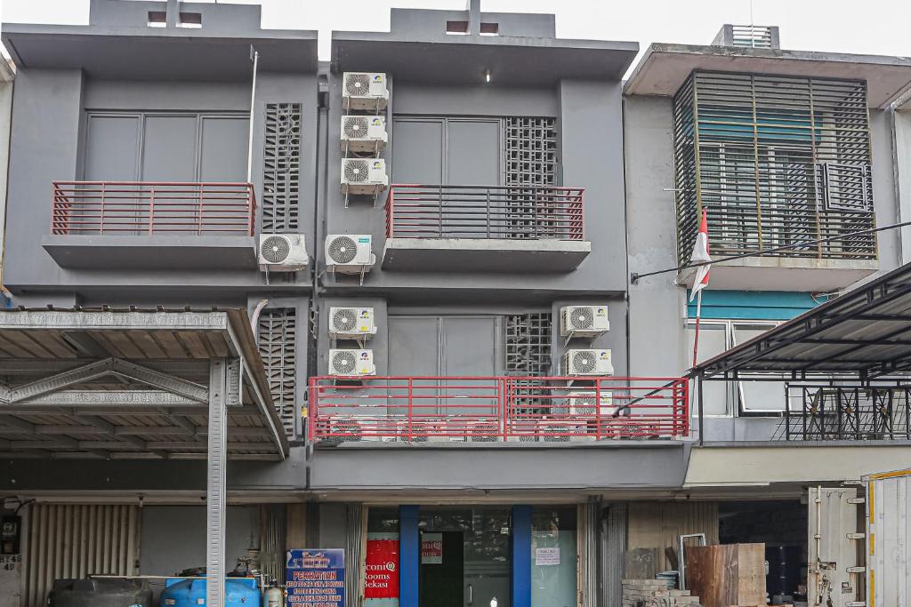 a building with air conditioners on the side of it at Hotel O Iconiq Rooms in Bekasi