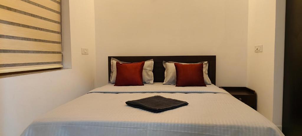 Postel nebo postele na pokoji v ubytování Zensta Residency