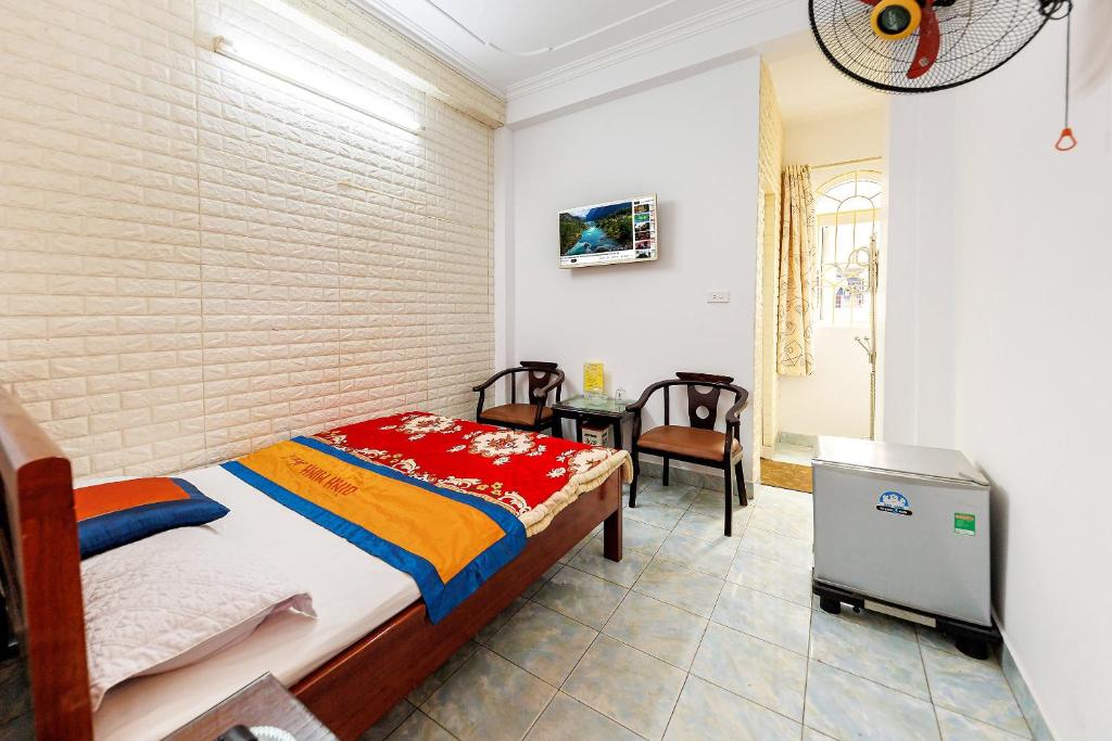 Postel nebo postele na pokoji v ubytování Binh Minh Ngoc Khanh Hotel