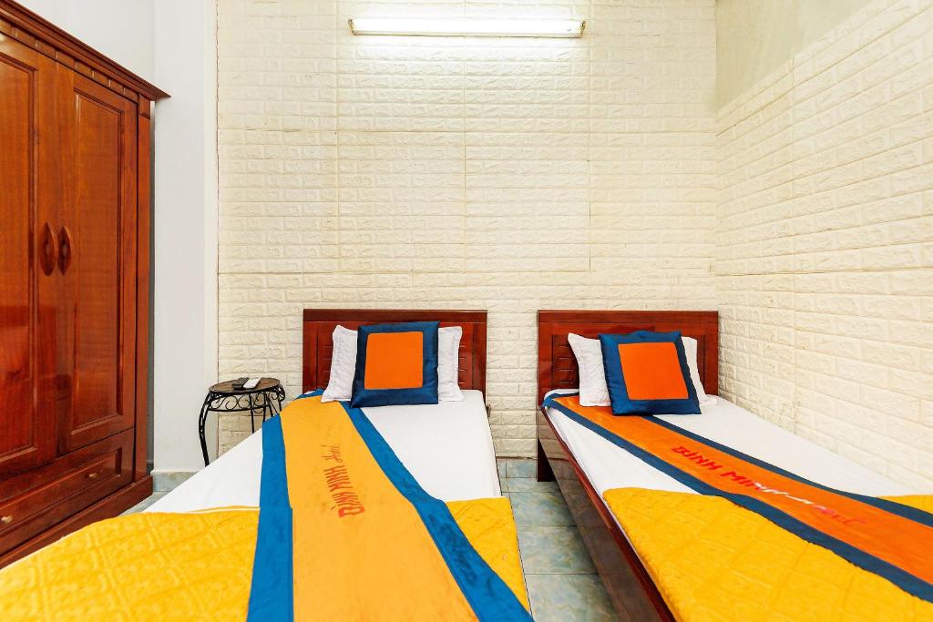 Postel nebo postele na pokoji v ubytování Binh Minh Ngoc Khanh Hotel