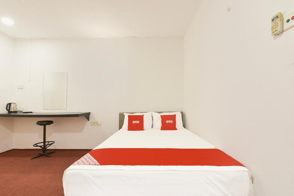 Postel nebo postele na pokoji v ubytování OYO 90963 Gest Inn