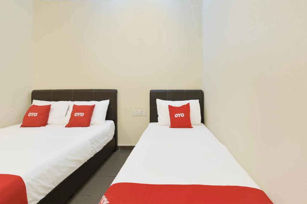 Postel nebo postele na pokoji v ubytování OYO 90963 Gest Inn